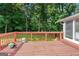 Spacious wooden deck overlooking the backyard, perfect for outdoor entertaining at 3210 Roseheath Ln, Lithonia, GA 30038