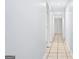 Neutral hallway with tiled floors at 3210 Roseheath Ln, Lithonia, GA 30038