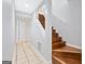Hallway with wooden staircase and tiled floor at 3210 Roseheath Ln, Lithonia, GA 30038