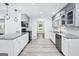 Updated kitchen showcasing sleek appliances, granite countertops, and modern fixtures at 3210 Roseheath Ln, Lithonia, GA 30038