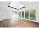 Bright sun room with a skylight, large windows, white brick wall and vinyl floors at 3210 Roseheath Ln, Lithonia, GA 30038