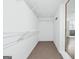 Walk-in closet with wire shelving and neutral colored carpet at 3210 Roseheath Ln, Lithonia, GA 30038