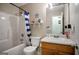 Standard bathroom featuring a tub/shower combination, toilet, and vanity with adequate lighting at 8915 Tweeddale Dr, Winston, GA 30187