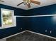 Bedroom with blue walls and a window at 1306 Stonemont Rd, Auburn, GA 30011