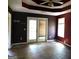 Bedroom featuring wood floors, ceiling fan, and a door leading to the exterior at 1306 Stonemont Rd, Auburn, GA 30011