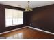 Dining room featuring hardwood floors and an ornate chandelier at 1306 Stonemont Rd, Auburn, GA 30011