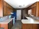 Galley kitchen with wooden cabinets, and white countertops at 1306 Stonemont Rd, Auburn, GA 30011