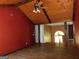 Living room with wood flooring, beamed ceiling, and open layout to the kitchen at 1306 Stonemont Rd, Auburn, GA 30011