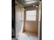 Tiled shower with multiple shower heads and a window at 1306 Stonemont Rd, Auburn, GA 30011