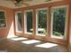Sun room with tile flooring and large windows at 1306 Stonemont Rd, Auburn, GA 30011