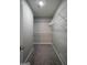 Walk-in closet with gray carpet and white shelving units for ample storage space at 2303 Sharon Se Ct, Conyers, GA 30013