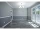 Dining room with natural light, wainscoting, and a view to a light fixture at 2303 Sharon Se Ct, Conyers, GA 30013