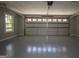 Spacious garage with a large door and a window for natural lighting at 2303 Sharon Se Ct, Conyers, GA 30013