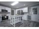 Updated kitchen featuring white cabinets, stainless steel appliances, and center island at 2303 Sharon Se Ct, Conyers, GA 30013
