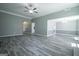 Spacious living room featuring modern gray paint and view into other areas of the home at 2303 Sharon Se Ct, Conyers, GA 30013
