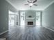 Open-concept living room with fireplace and large windows offering ample natural light at 2303 Sharon Se Ct, Conyers, GA 30013