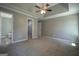 Main bedroom with ceiling fan and ensuite bathroom at 2303 Sharon Se Ct, Conyers, GA 30013