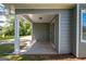 Cozy covered patio with sliding glass door and exterior light at 2303 Sharon Se Ct, Conyers, GA 30013