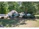 View of the pool house, trees, and bushes at the community pool at 2303 Sharon Se Ct, Conyers, GA 30013