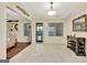 Inviting entryway featuring neutral tones, tile flooring, and ample natural light from the surrounding windows at 395 Sylvan Loop, Fayetteville, GA 30214