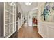 Welcoming entryway featuring hardwood floors, decorative molding, and an open doorway at 395 Sylvan Loop, Fayetteville, GA 30214