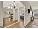 Hallway with hardwood flooring featuring bedroom and living room access at 395 Sylvan Loop, Fayetteville, GA 30214