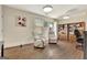 Cozy living room with light walls, two recliner chairs, ceiling fans, and a bookcase at 395 Sylvan Loop, Fayetteville, GA 30214