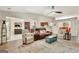 Spacious living room with a ceiling fan, plush seating, and open layout design at 395 Sylvan Loop, Fayetteville, GA 30214