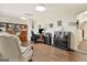 Home office featuring neutral walls, hardwood floors, bookcase, and a comfortable workspace at 395 Sylvan Loop, Fayetteville, GA 30214