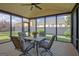 Screened-in porch with dining set and chairs; great view of the backyard at 395 Sylvan Loop, Fayetteville, GA 30214