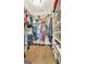 Well-organized walk-in closet with built-in shelving for ample storage of clothes, shoes, and accessories at 395 Sylvan Loop, Fayetteville, GA 30214