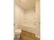 Bright bathroom featuring a clean, white bathtub and shower with tiled walls and updated fixtures at 1225 Hibiscus Way, Mcdonough, GA 30253