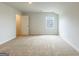 Spacious bedroom featuring neutral carpeting, natural light from the window, and a bright, airy atmosphere at 1225 Hibiscus Way, Mcdonough, GA 30253