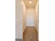 Empty carpeted walk-in closet with white walls and wire shelving, offering ample storage space at 1225 Hibiscus Way, Mcdonough, GA 30253