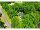 Aerial view of a home surrounded by trees is off a paved road at 97 Coral Dr, Whitesburg, GA 30185