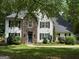 Charming two-story home featuring a stone facade, a welcoming entrance, and well-maintained landscaping at 97 Coral Dr, Whitesburg, GA 30185