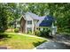 Charming two-story home with stone accents, landscaped yard, and a lush, wooded setting at 97 Coral Dr, Whitesburg, GA 30185