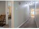 Upstairs hallway with carpet, neutral paint, and open doorways to bedrooms on either side at 97 Coral Dr, Whitesburg, GA 30185