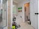 Modern main bathroom features a glass enclosed shower and a separate soaking tub by the window at 97 Coral Dr, Whitesburg, GA 30185