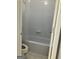 Bathroom featuring a tub and shower combination, with white subway tile and bright white fixtures at 2119 Pine Heights Ne Dr, Atlanta, GA 30324