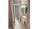 Bathroom showcases a white tiled floor, granite vanity, toilet, and towel rack at 2119 Pine Heights Ne Dr, Atlanta, GA 30324