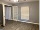 Bright bedroom with wood floors, natural light from the window, and door leading to closet at 2119 Pine Heights Ne Dr, Atlanta, GA 30324