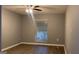 Bedroom featuring a window, ceiling fan and wood-look flooring at 2119 Pine Heights Ne Dr, Atlanta, GA 30324