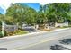 Street view of Lenox Heights Condominiums entrance with established landscaping and mature trees at 2119 Pine Heights Ne Dr, Atlanta, GA 30324