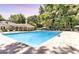 Large community pool surrounded by lounge chairs and mature trees, perfect for relaxation and recreation at 2119 Pine Heights Ne Dr, Atlanta, GA 30324