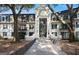 Charming condo building with striking architecture and mature trees at 2119 Pine Heights Ne Dr, Atlanta, GA 30324