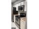 Well-lit kitchen with stainless steel appliances and white cabinetry at 2119 Pine Heights Ne Dr, Atlanta, GA 30324