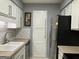 Clean kitchen featuring stainless steel appliances, white cabinets, and subway tile backsplash at 2119 Pine Heights Ne Dr, Atlanta, GA 30324