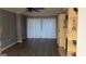 Bright living room featuring a fireplace, built-in shelving, and stylish wood-look flooring at 2119 Pine Heights Ne Dr, Atlanta, GA 30324