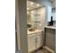 Interior shot of the wet bar area, featuring a mirror backsplash and storage at 2119 Pine Heights Ne Dr, Atlanta, GA 30324